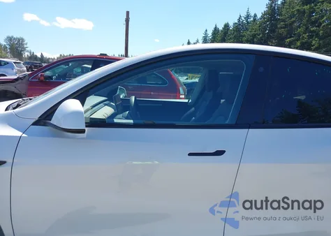 2023 Tesla Model Y Awd/Long Range Dual Motor All-Wheel Drive z USA, uszkodzony, nr VIN 7SAYGAEE1PF700262